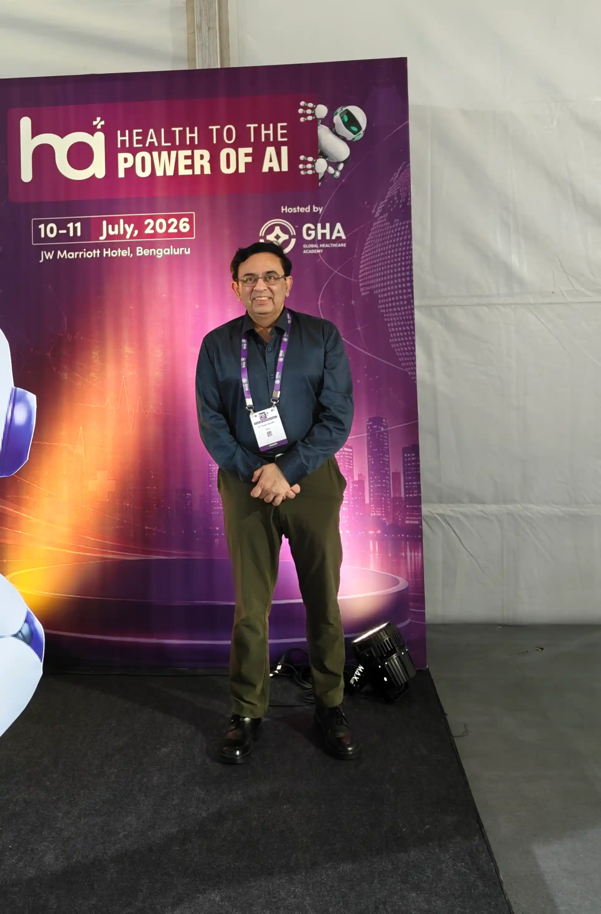 Dr. Arpan Gandhi at the Health to the Power of AI Conclave 2026 backdrop, JW Marriott Bengaluru