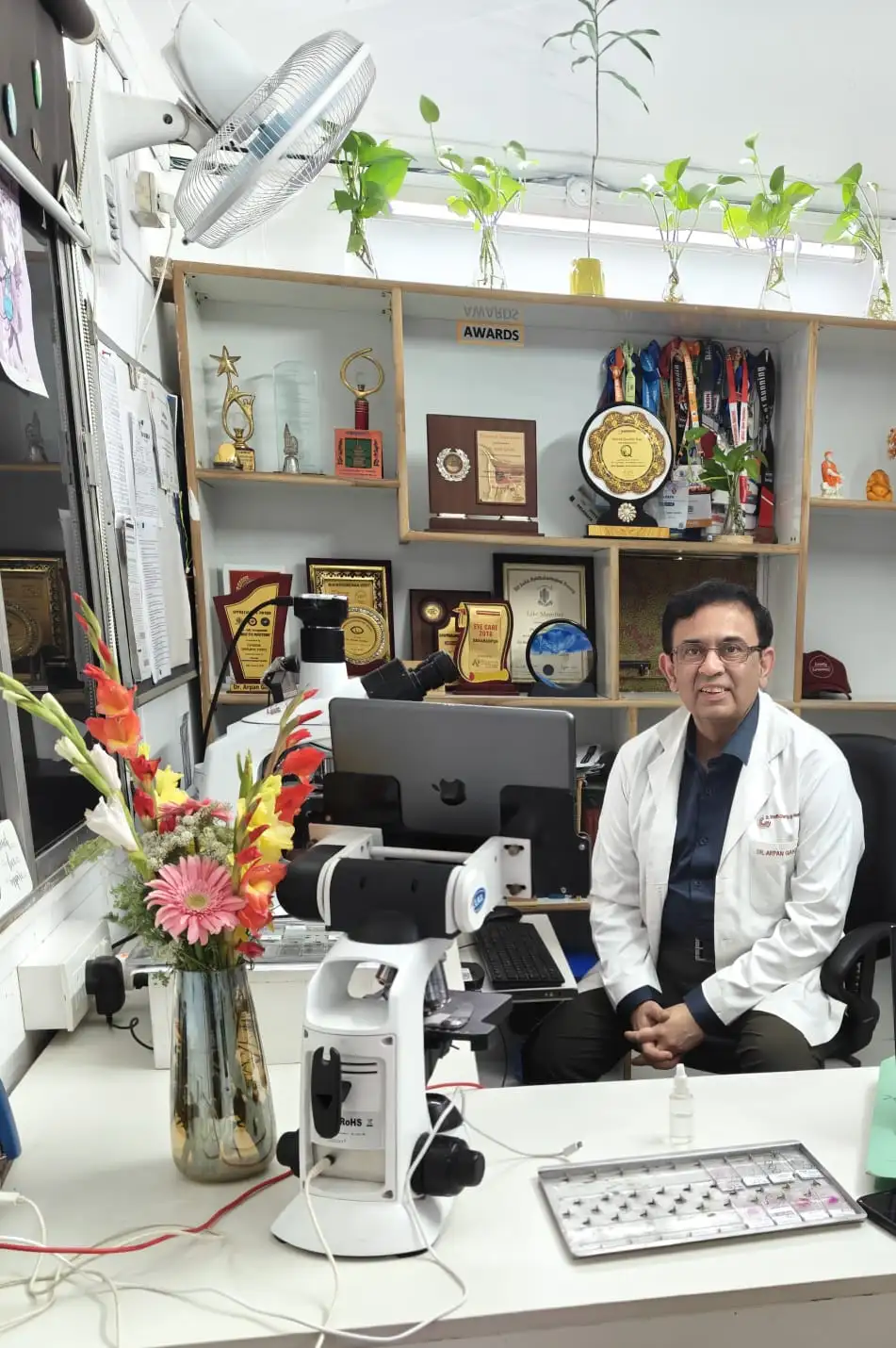 Dr. Arpan Gandhi at his desk