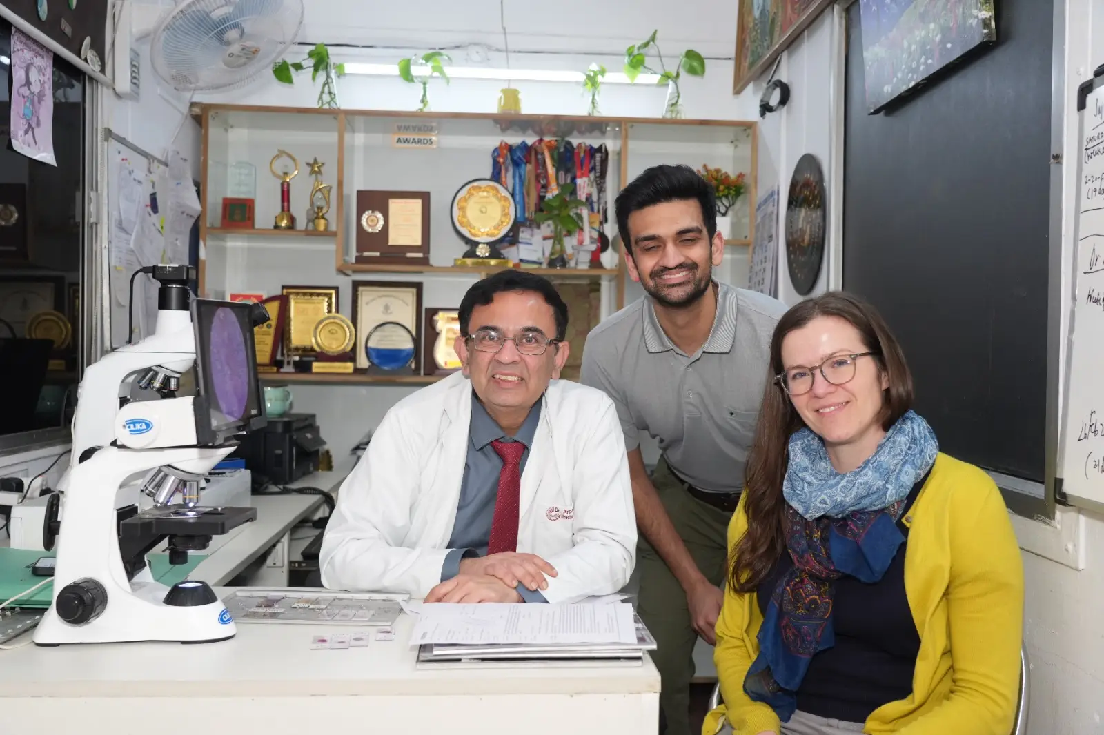 Dr. Arpan Gandhi with mentees in his office